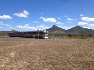 Savannahlander on Forsyth to Cairns line with Boonmoo Hill in background