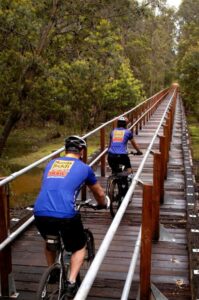 Crossing the timber railway bridge over St John Brook. (Department of Environment and Conservation and Munda Biddi Trail Foundation)