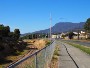 The cycleway runs parallel to the old railway line. Note the view of Kunanyi (Mt Wellington). 2022