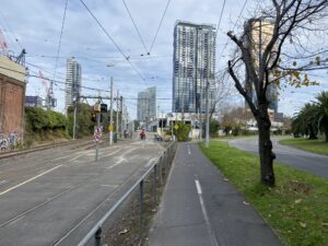 Riders cross the tracks in front of Southbank tram depot [2023]