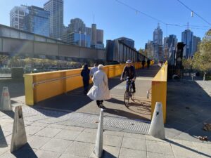 A massive ramp takes the rail bridge down to street level [2023]