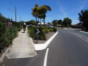 intersection avoided by cyclists using vegetated traffic island in Brighton - Oct 20