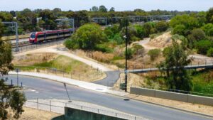 Leaving Mawson Lakes with the trail on the right and the train on the left - Feb 24